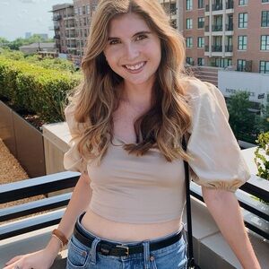 Light brown puff sleeve crop top with open back